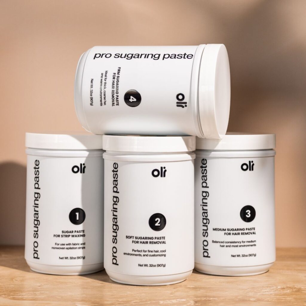 OLI Pro-fourmance sugaring paste set - four large 50oz jars of professional sugar wax for natural hair removal, shown side by side